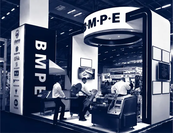 The BMPE exhibition stand with machines running at a trade show