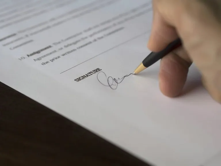 A service agreement being signed